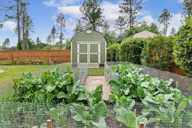 182 Brendamoore Ct, Fuquay Varina, NC 27526 - fenced backyard featuring a vegetable garden