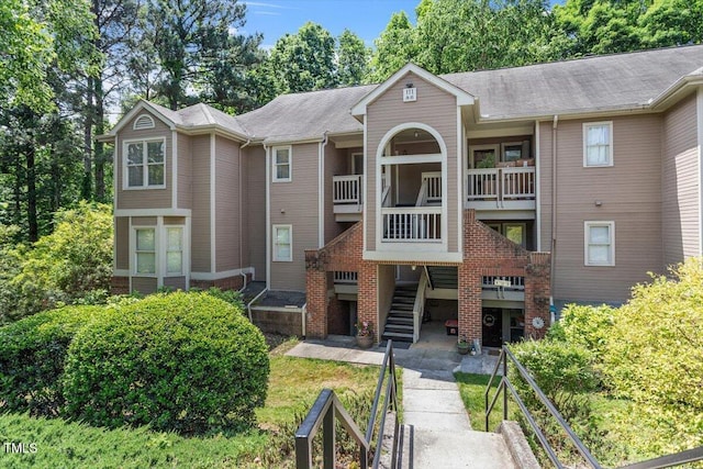 111 Killam Ct Unit 2A, Cary, NC 27513 - view of property with stairs and view of scattered trees