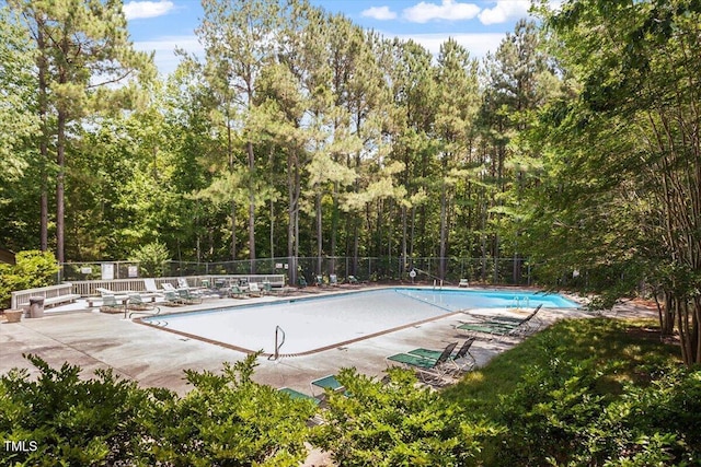 111 Killam Ct Unit 2A, Cary, NC 27513 - community pool featuring fence, a patio area, and a forest view