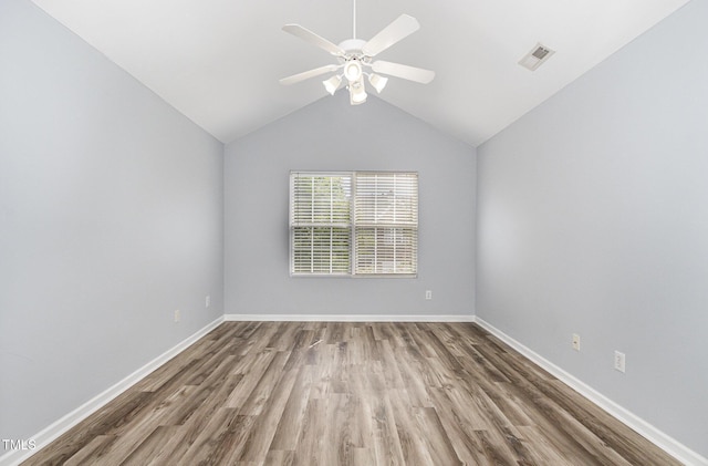 958 Shining Wire Way, Morrisville, NC 27560 - spare room featuring wood finished floors, a ceiling fan, and lofted ceiling