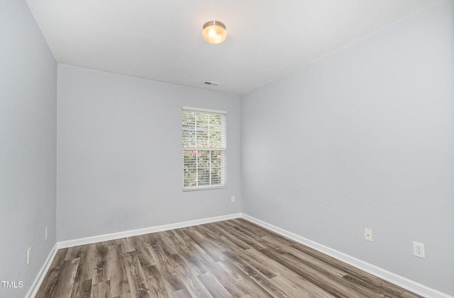 958 Shining Wire Way, Morrisville, NC 27560 - empty room with wood finished floors and baseboards
