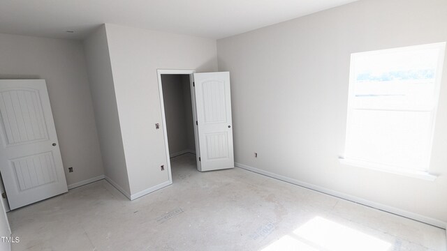 unfurnished bedroom featuring baseboards
