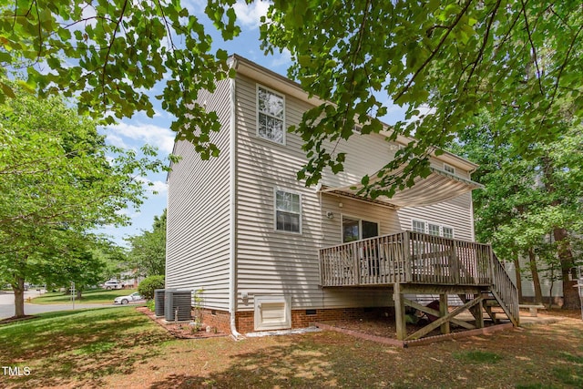 back of house featuring crawl space, a deck, central AC, and stairs