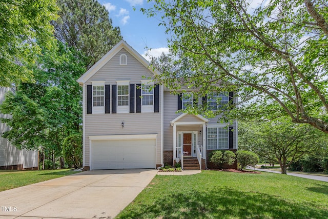 view of front of house featuring an attached garage, driveway, and a front yard