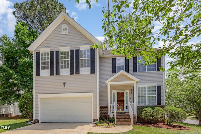 view of front of house featuring an attached garage, concrete driveway, and brick siding