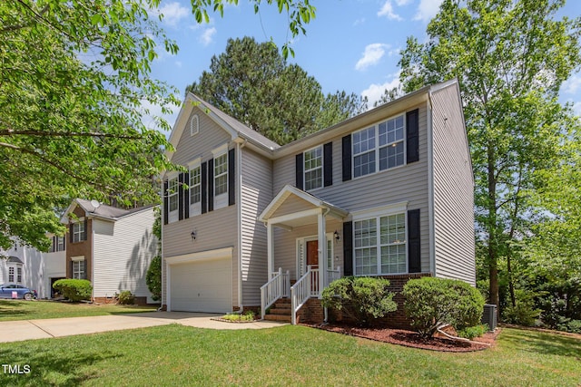 traditional-style home featuring an attached garage, concrete driveway, and a front lawn