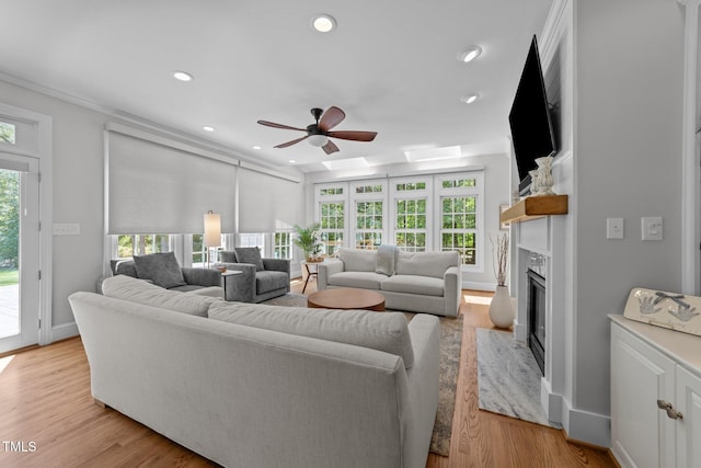 120 Harmony Hill Ln, Cary, NC 27513 - living room with a ceiling fan, a premium fireplace, recessed lighting, light wood-style flooring, and baseboards