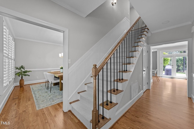 120 Harmony Hill Ln, Cary, NC 27513 - stairs with wood finished floors, french doors, and crown molding