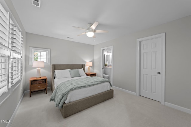 120 Harmony Hill Ln, Cary, NC 27513 - bedroom featuring light colored carpet, baseboards, ensuite bathroom, and a ceiling fan
