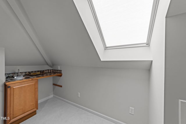 120 Harmony Hill Ln, Cary, NC 27513 - interior space with a sink, a skylight, vaulted ceiling, and baseboards
