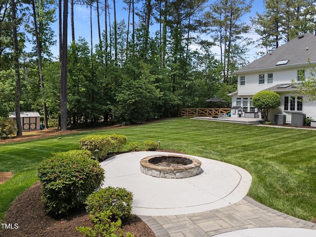 120 Harmony Hill Ln, Cary, NC 27513 - view of yard with an outdoor fire pit, a patio area, and central air condition unit