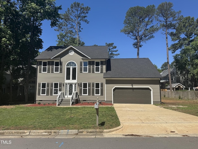 colonial house with an attached garage, driveway, and crawl space