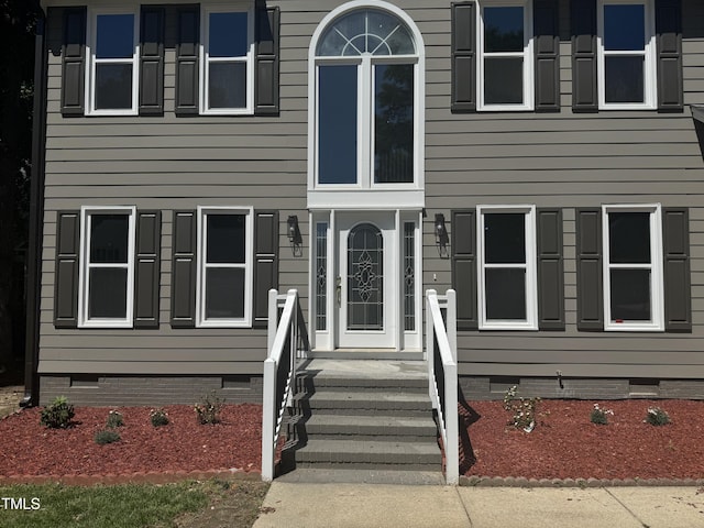 view of front of home with crawl space