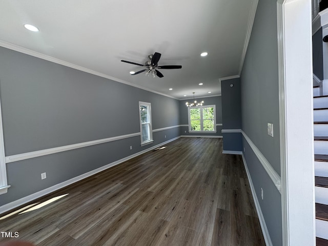 empty room with a chandelier, crown molding, dark wood-type flooring, stairway, and recessed lighting