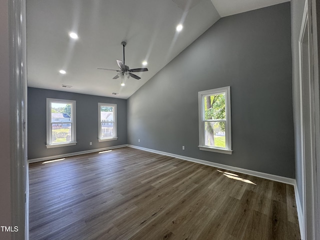unfurnished room with a ceiling fan, wood finished floors, recessed lighting, baseboards, and high vaulted ceiling