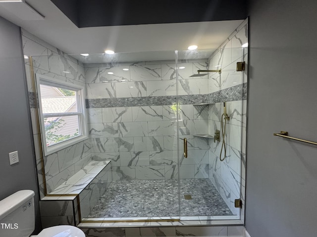 full bath featuring toilet and a shower stall