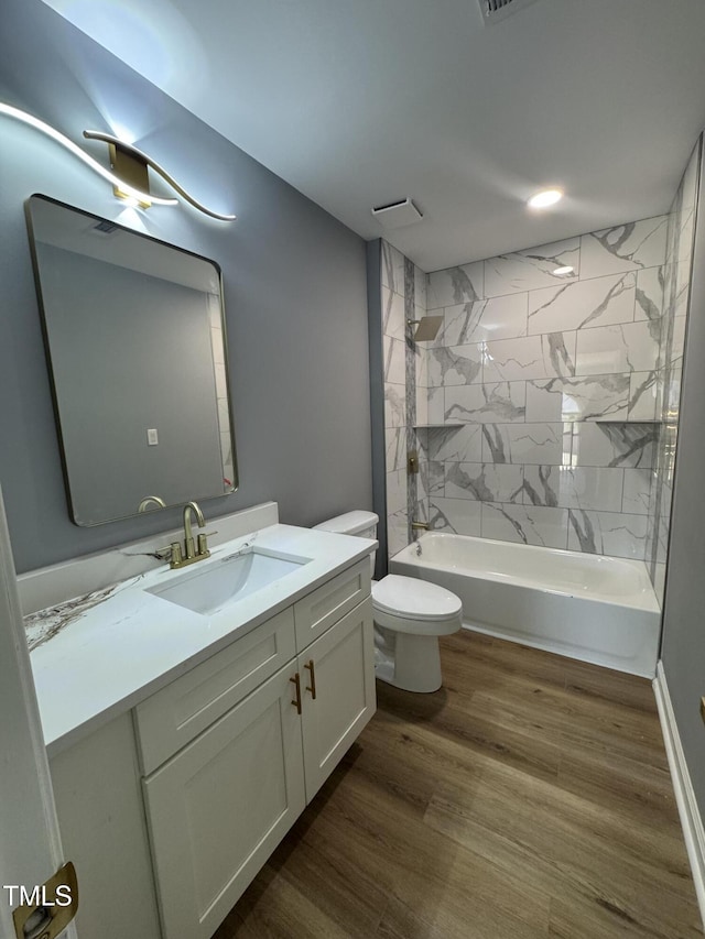 full bathroom with vanity, toilet, tub / shower combination, and wood finished floors