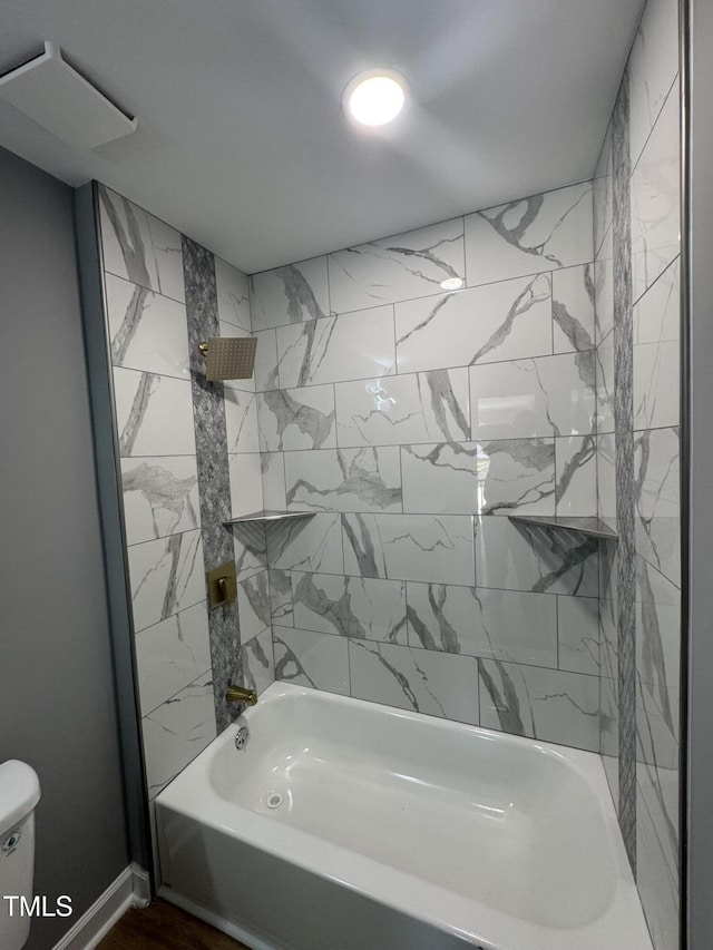 bathroom with shower / tub combination and toilet