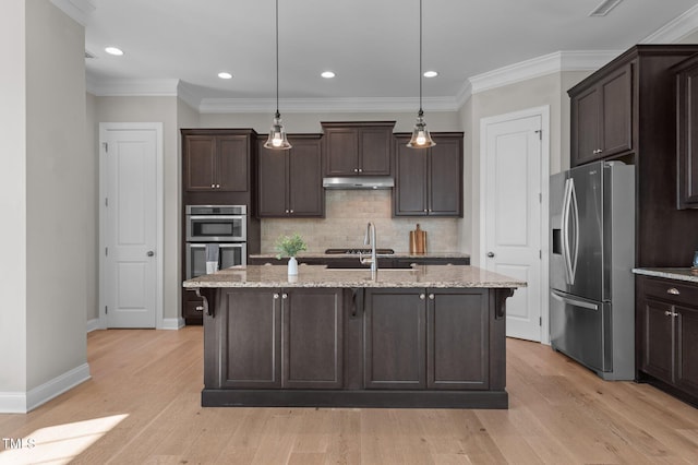 kitchen featuring appliances with stainless steel finishes, dark brown cabinetry, backsplash, light wood finished floors, and ornamental molding
