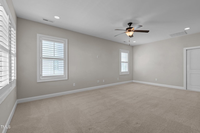 unfurnished room featuring ceiling fan, baseboards, light carpet, and recessed lighting