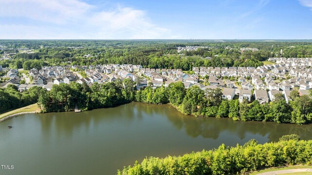 aerial view of residential area with a large body of water