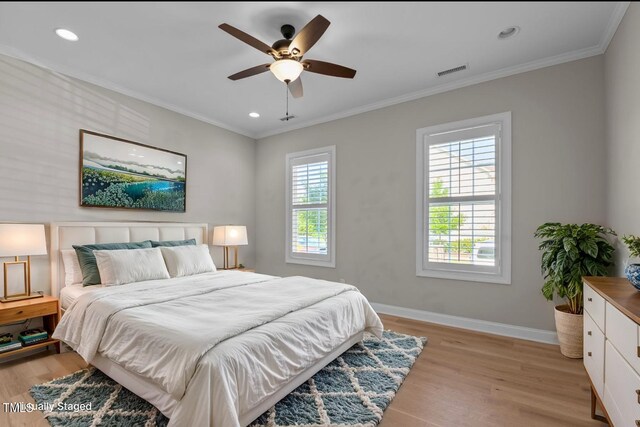 bedroom with baseboards, light wood-style flooring, ornamental molding, recessed lighting, and a ceiling fan
