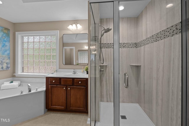 bathroom with a stall shower, tile patterned flooring, and a bath