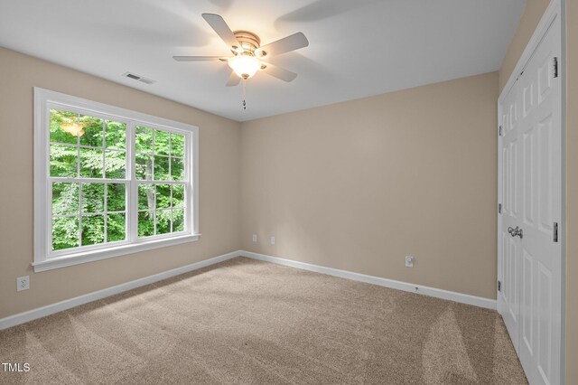 unfurnished bedroom with a closet, baseboards, and carpet
