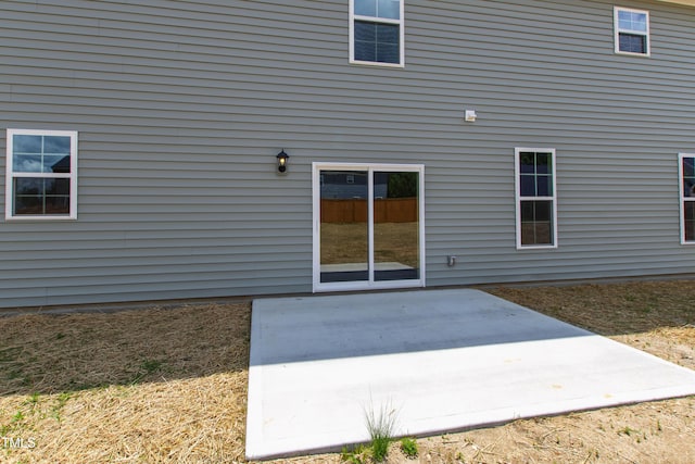 50 Rosewood Ln, Youngsville, NC 27596 - rear view of property with a patio area