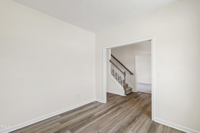 50 Rosewood Ln, Youngsville, NC 27596 - empty room featuring wood finished floors, stairs, and baseboards
