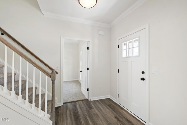 50 Rosewood Ln, Youngsville, NC 27596 - foyer entrance featuring dark wood-style floors, stairs, ornamental molding, and baseboards