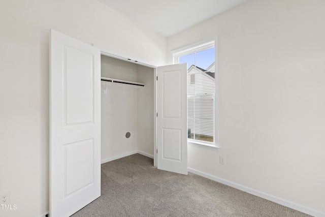 50 Rosewood Ln, Youngsville, NC 27596 - unfurnished bedroom with carpet floors, baseboards, and a closet