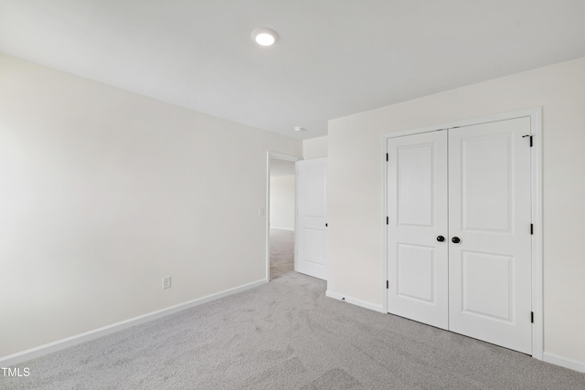 50 Rosewood Ln, Youngsville, NC 27596 - unfurnished bedroom featuring carpet, baseboards, and a closet