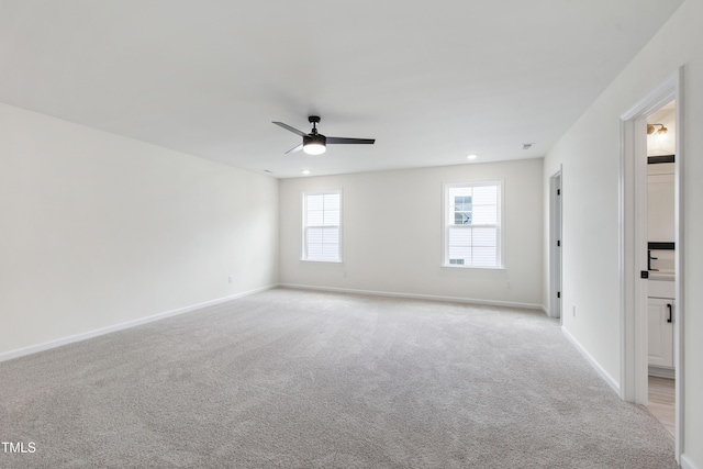 50 Rosewood Ln, Youngsville, NC 27596 - spare room featuring ceiling fan, light colored carpet, baseboards, and recessed lighting