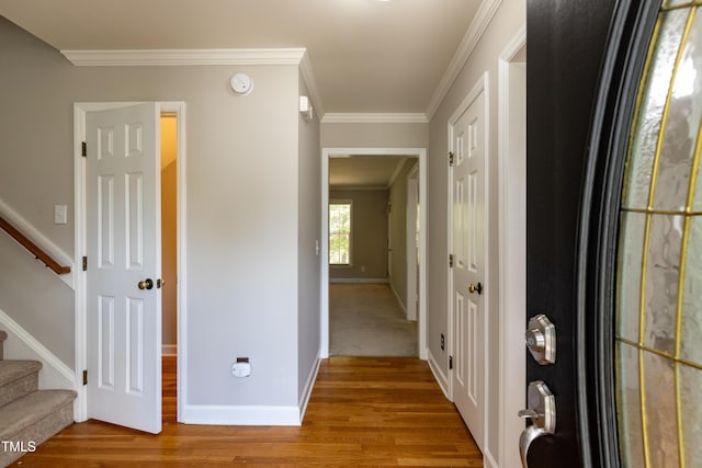 716 Lakeview Ave, Wake Forest, NC 27587 - hall with light wood-style floors, crown molding, stairs, and baseboards