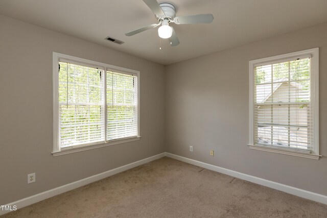 716 Lakeview Ave, Wake Forest, NC 27587 - empty room with baseboards, light colored carpet, and ceiling fan