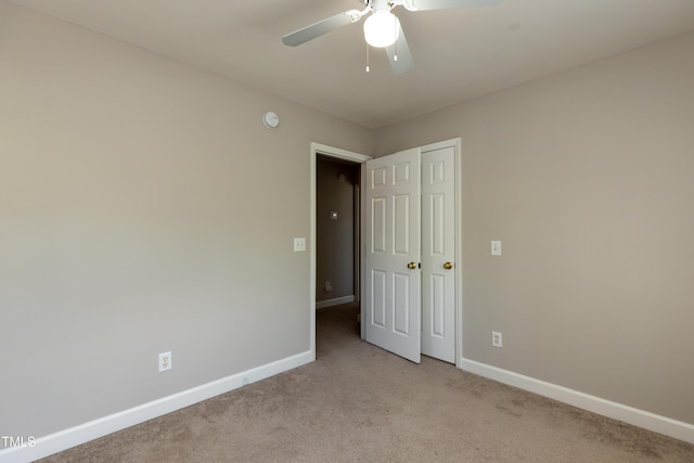 716 Lakeview Ave, Wake Forest, NC 27587 - unfurnished bedroom with carpet, baseboards, and a ceiling fan