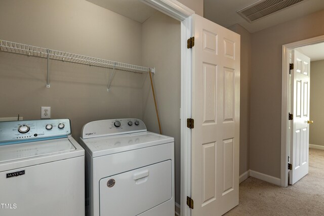 716 Lakeview Ave, Wake Forest, NC 27587 - clothes washing area featuring independent washer and dryer, light carpet, and baseboards