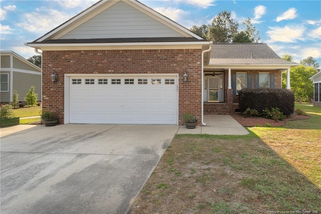 3024 Metthame Dr, Fayetteville, NC 28306 - view of front of home with brick siding, driveway, a front lawn, and a garage