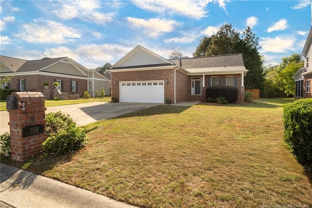 3024 Metthame Dr, Fayetteville, NC 28306 - view of front of property with driveway, an attached garage, brick siding, and a front lawn
