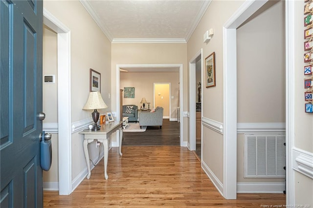 3024 Metthame Dr, Fayetteville, NC 28306 - foyer featuring light wood finished floors and ornamental molding