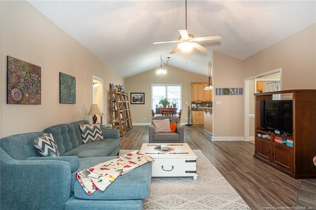 3024 Metthame Dr, Fayetteville, NC 28306 - living area featuring dark wood-type flooring, a ceiling fan, lofted ceiling, and baseboards