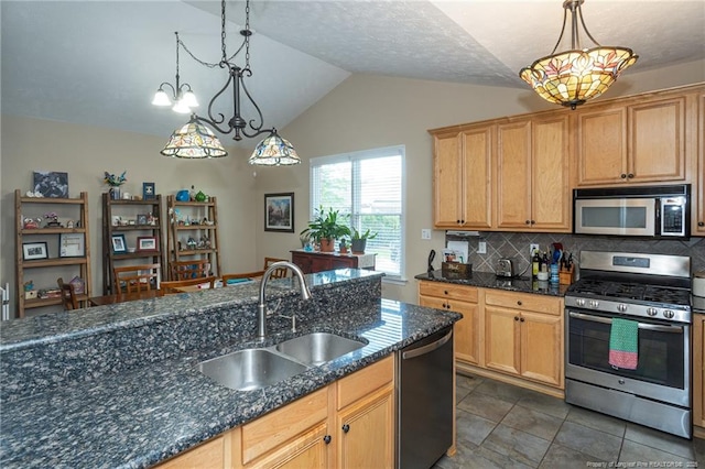 3024 Metthame Dr, Fayetteville, NC 28306 - kitchen featuring stainless steel appliances, a sink, lofted ceiling, backsplash, and hanging light fixtures