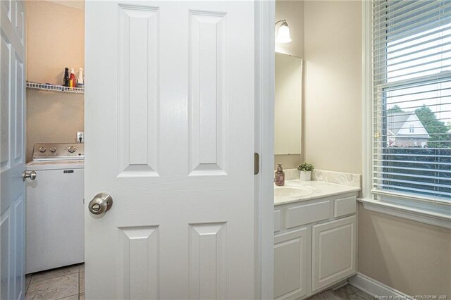 3024 Metthame Dr, Fayetteville, NC 28306 - bathroom featuring washer / clothes dryer and vanity