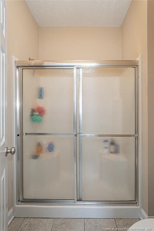 3024 Metthame Dr, Fayetteville, NC 28306 - bathroom with a shower stall and tile patterned flooring