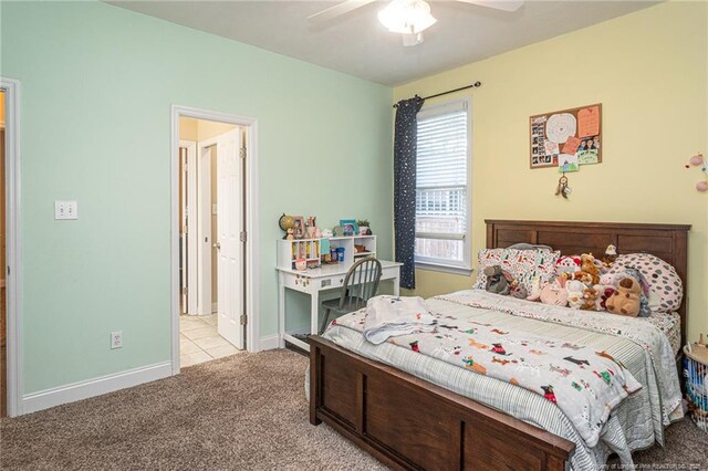 3024 Metthame Dr, Fayetteville, NC 28306 - bedroom featuring light carpet, baseboards, ceiling fan, ensuite bath, and light tile patterned floors