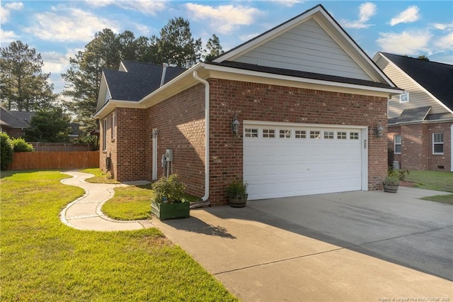 3024 Metthame Dr, Fayetteville, NC 28306 - view of side of home with concrete driveway, brick siding, and an attached garage
