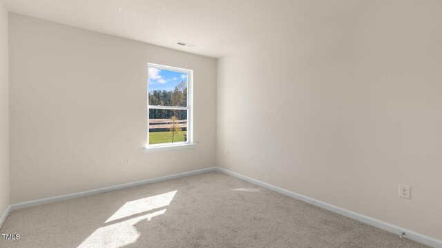 826 Old Tarboro Rd, Wendell, NC 27591 - unfurnished room featuring healthy amount of natural light, carpet floors, and baseboards