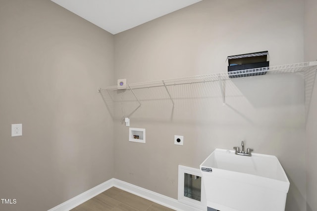 laundry room featuring baseboards, washer hookup, and hookup for an electric dryer
