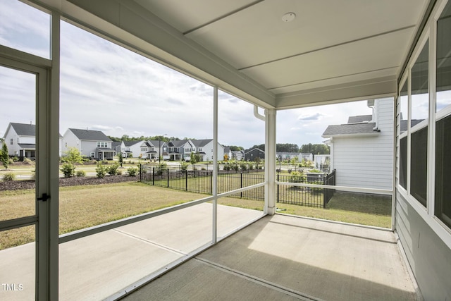 unfurnished sunroom featuring a residential view